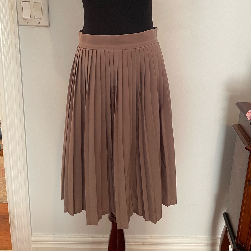 Size medium tan American Apparel pleated silky skirt, hits right above the knee